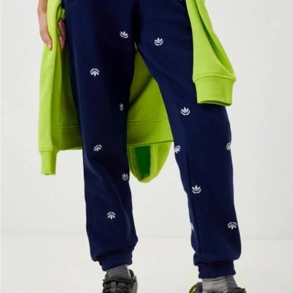 Adidas original navy blue joggers with pockets and stitched logos pattern